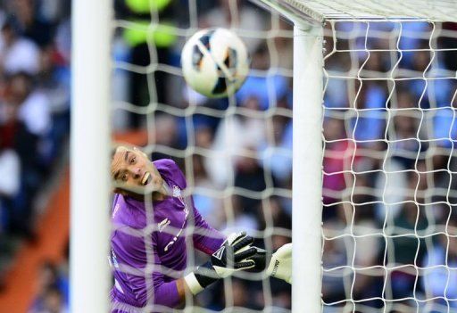 Celta&#039;s goalkeeper Sergio Alvarez eyes the ball as Real Madrid&#039;s forward Gonzalo Higuain scores