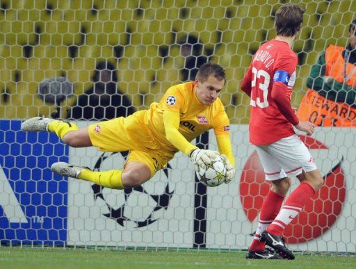 Artem Rebrov (L) of FC Spartak Moscow saves his net playing against SL Benfica