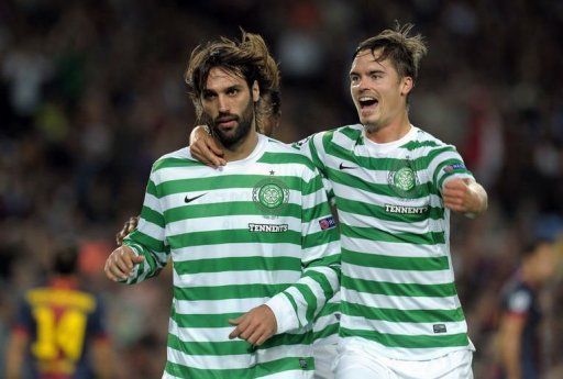 Celtic&#039;s Georgios Samaras (L) and Mikael Lustig celebrate a goal