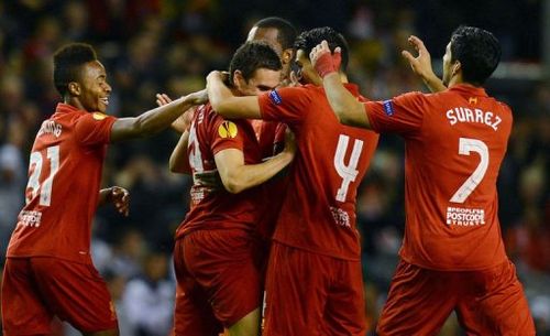 Liverpool's Stewart Downing (2nd L) celebrates with teammates after scoring