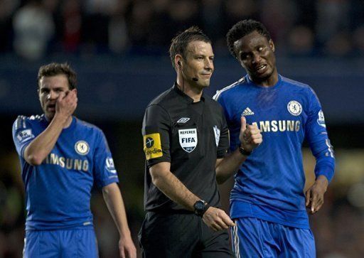 Chelsea&#039;s John Obi Mikel (right) talks to referee Mark Clattenburg during Sunday&#039;s game at Stamford Bridge