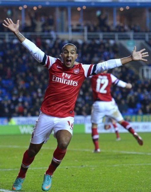 Arsenal's Theo Walcott celebrates their late fourth goal against Reading