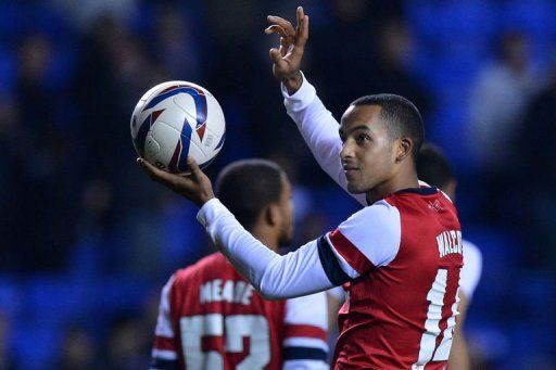 Theo Walcott salutes the crowd on October 30