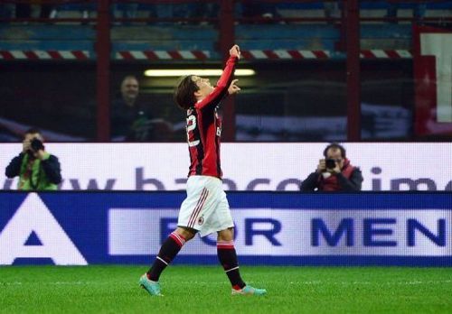 AC Milan's forward Bojan Krkic (C) celebrates after scoring