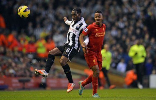 Newcastle United&#039;s Vurnon Anita (L) vies with Liverpool&#039;s Raheem Sterling (R)