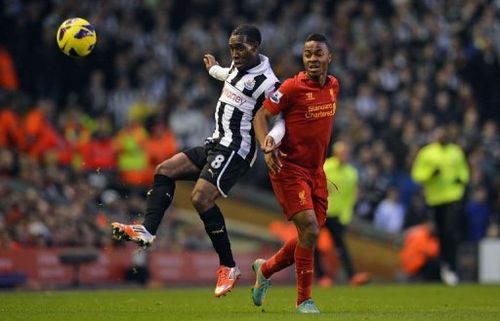 Newcastle United's Vurnon Anita (L) vies with Liverpool's Raheem Sterling (R)