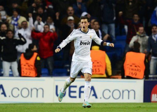 Real Madrid&#039;s Mesut Ozil celebrates after scoring