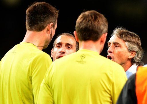 Roberto Mancini went onto the pitch to confront referee Peter Rasmussen at the final whistle