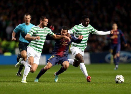 Barcelona&#039;s Pedro Rodriguez (C) trys to get between Celtic&#039;s Joe Ledley (L) and Victor Wanyama