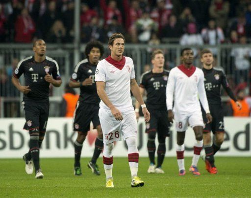 Lille&#039;s Nolan Roux (C) looks up at the scoreboard during their match against Bayern Munich