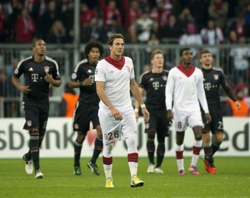 Lille's Nolan Roux (C) looks up at the scoreboard during their match against Bayern Munich