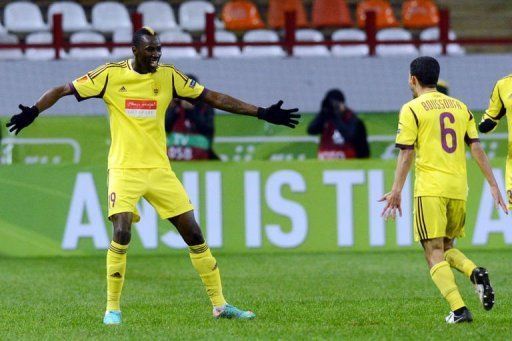 FC Anzhi Makhachkala&#039;s Lacina Traore (L) celebrates with Mbark Boussoufa after scoring