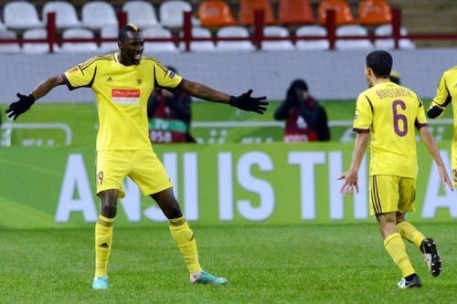 FC Anzhi Makhachkala's Lacina Traore (L) celebrates with Mbark Boussoufa after scoring