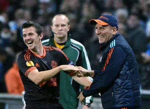 Marseille&#039;s Joey Barton (L) reacts with coach Elie Baup (R) after scoring