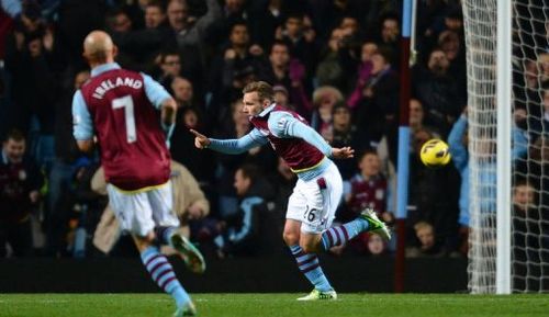 Aston Villa's  striker Andreas Weimann (R) celebrates after scoring