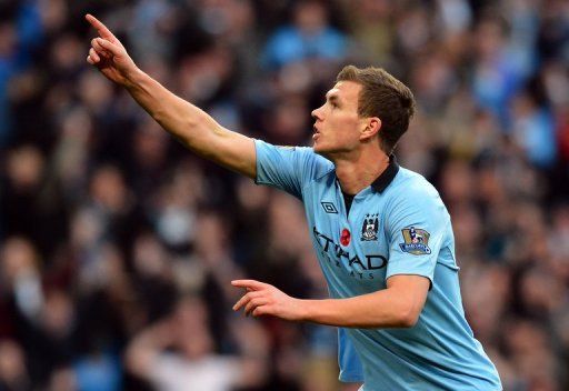 Manchester City&#039;s Bosnian Edin Dzeko celebrates scoring their second goal