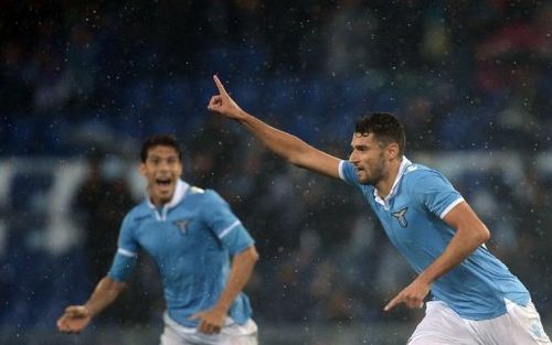 Lazio's Luis Pedro Cavanda (R) celebrates after scoring