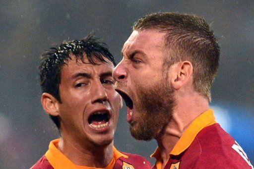 AS Roma&#039;s defender Ivan Rodrigo Piris (L) and midfielder Daniele De Rossi react during the derby