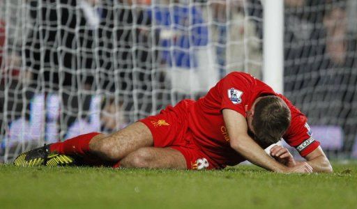 Steven Gerrard lies injured during the Premier League match between Chelsea and Liverpool