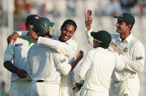 Bangladesh bowler Sohag Gazi (centre) celebrates with teammates