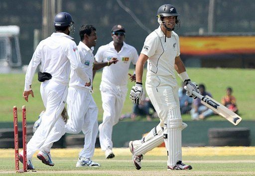 New Zealand skipper Ross Taylor walks back after being dismissed