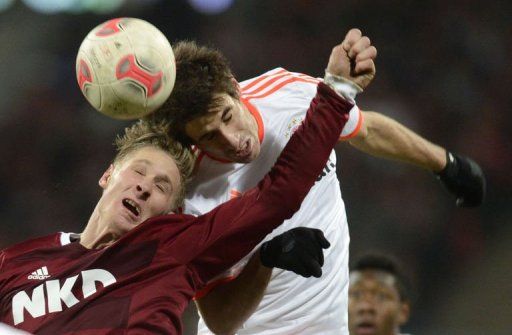 Bayern Munich&#039;s midfielder Javi Martinez (R) and Nuremberg&#039;s striker Sebastian Polter challenge for the ball