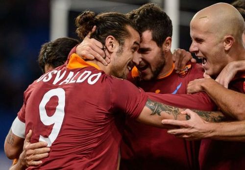 AS Roma's Pablo Osvaldo (L) celebrates with his team mates after scoring