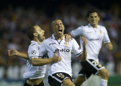 Valencia&#039;s Sofiane Feghouli (C) celebrates after scoring