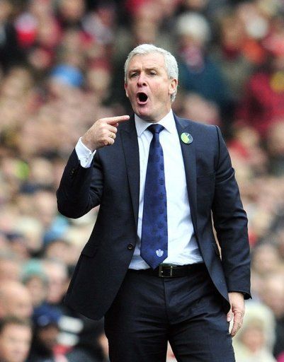 Former Queens Park Rangers manager Mark Hughes gestures during an English Premier League football match