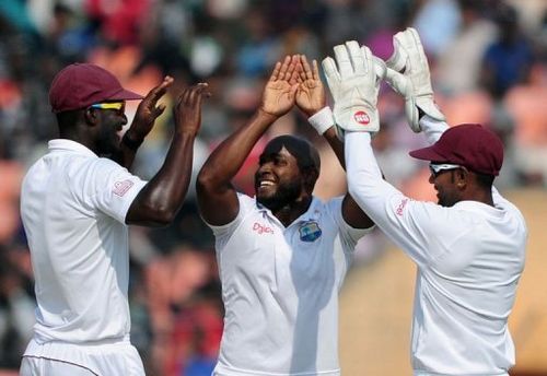 West Indies bowler Tino Best (centre) celebrates the dismissal of Bangladesh's Shahriar Nafees (unseen)