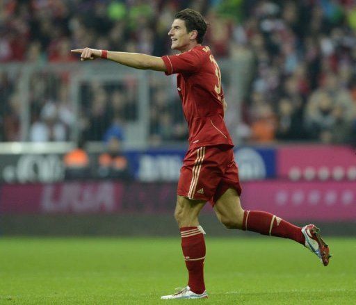 Bayern Munich&#039;s striker Mario Gomez celebrates the fifth goal against Hanover 96