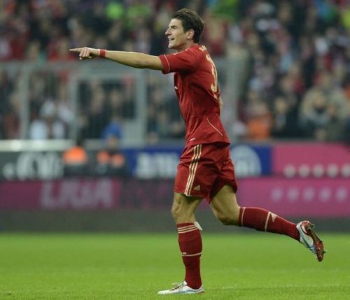 Bayern Munich's striker Mario Gomez celebrates the fifth goal against Hanover 96