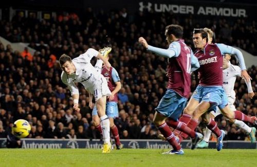 Tottenham Hotspur's Gareth Bale (left) scores a goal against West Ham