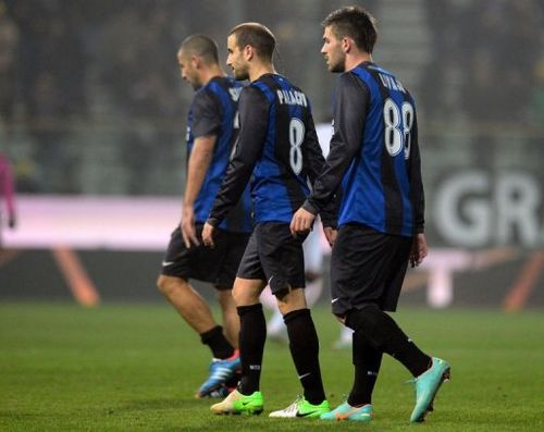 Inter's players Walter Samuel Rodrigo Palacio (C) and Marko Livaja (R) leave the pitch at the end of  the match