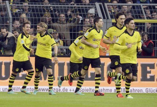 Dortmund enjoyed their third consecutive away win with goals by Marco Reus and Poland striker Robert Lewandowski