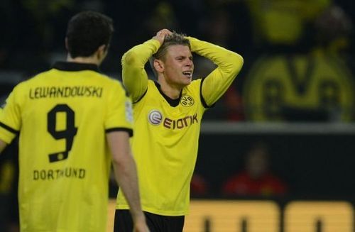 Dortmund's Lukasz Piszczek reacts after the match