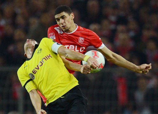 Duesseldorf&#039;s Leon Balogun (R) and Dortmund&#039;s Sebastian Kehl