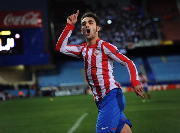 MADRID, SPAIN - MARCH 08:  Adrian Lopez of Club Atletico de Madrid celebrates scoring his sides third goal during the UEFA Europa League round of 16 first leg match between Club Atletico de Madrid and Besiktas JK at the Vincente Calderon stadium on March 8, 2012 in Madrid, Spain.  