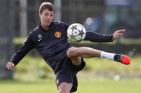 MANCHESTER, ENGLAND - OCTOBER 1:  Jonny Evans takes part in a Manchester United training session at the Carrington Training Ground on October 1, 2012 in Manchester, England.