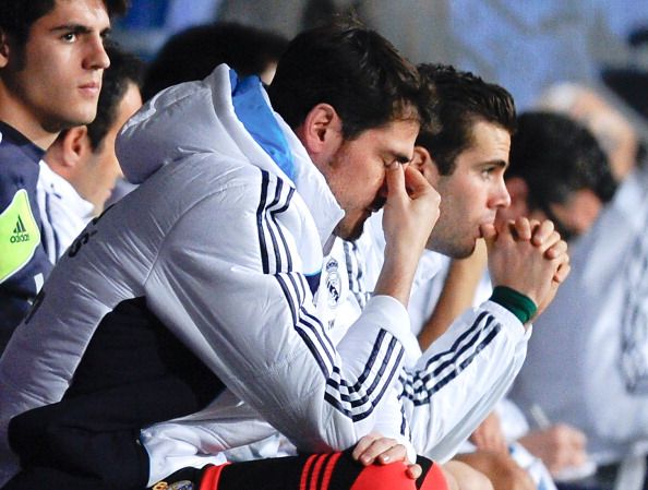 MALAGA, SPAIN - DECEMBER 22:  Iker Casillas of Real Madrid CF reacts dejected on the bench after Roque Santa Cruz of Malaga CF scored his team&#039;s second goal during the La Liga match between Malaga CF and Real Madrid CF at La Rosaleda Stadium on December 22, 2012 in Malaga, Spain.