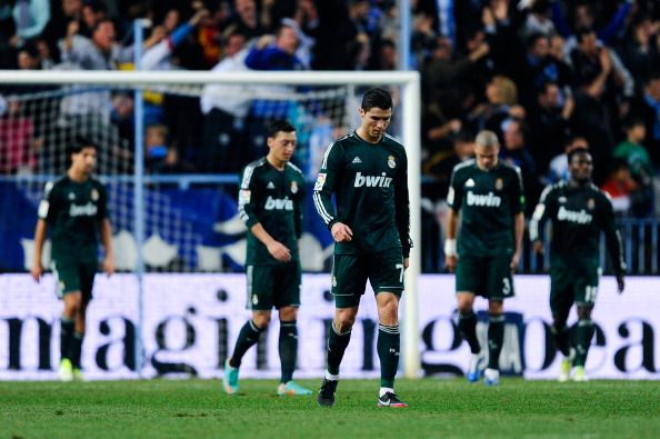 MALAGA, SPAIN - DECEMBER 22:  Cristiano Ronaldo of Real Madrid CF reacts dejected afte Roque Santa Cruz of Malaga CF scored his team&#039;s third goal during the La Liga match between Malaga CF and Real Madrid CF at La Rosaleda Stadium on December 22, 2012 in Malaga, Spain.  