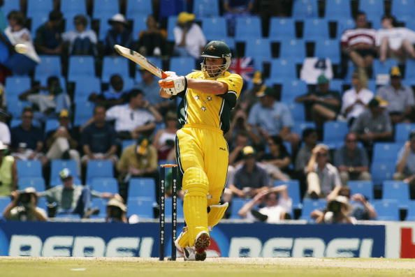 Adam Gilchrist of Australia hits a six