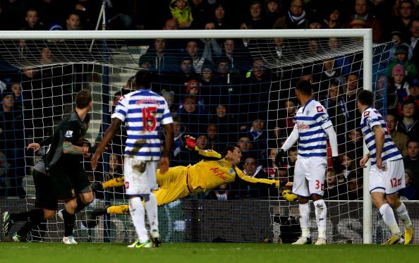 Goalkeeper Julio Cesar of QPR dives in vain as Daniel Agger (L) of Liverpool scores his team&#039;s third goal 