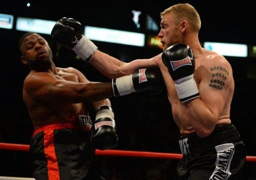 Former England cricket captain Andrew Flintoff (R) fights American Richard Dawson