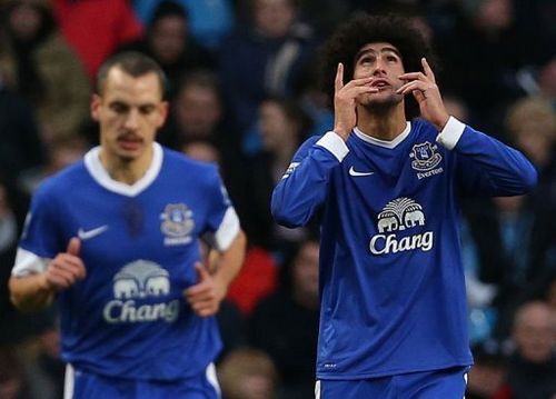 Everton's striker Marouane Fellaini celebrates (R) scoring