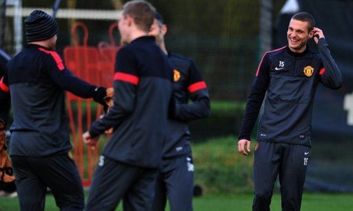 Vidic (R) trained with United on Tuesday morning ahead of the Group H encounter at Old Trafford