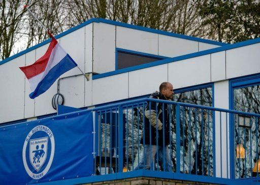 A flag flies half-mast on December 4 at the clubhouse of the Dutch football club SC Buitenboys in Almere