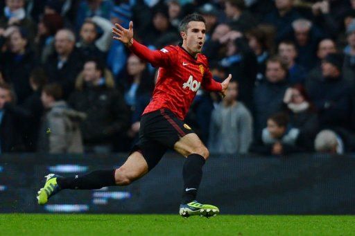 Robin van Persie celebrates his stoppage-time winner at the Etihad Stadium