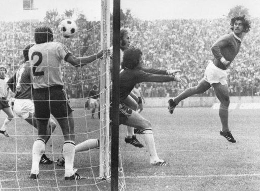 West German forward Gerd Mueller (R) scores against Australia in 1974 in Hamburg