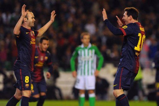 Barcelona&#039;s Lionel Messi (R) celebretes with Andres Iniesta